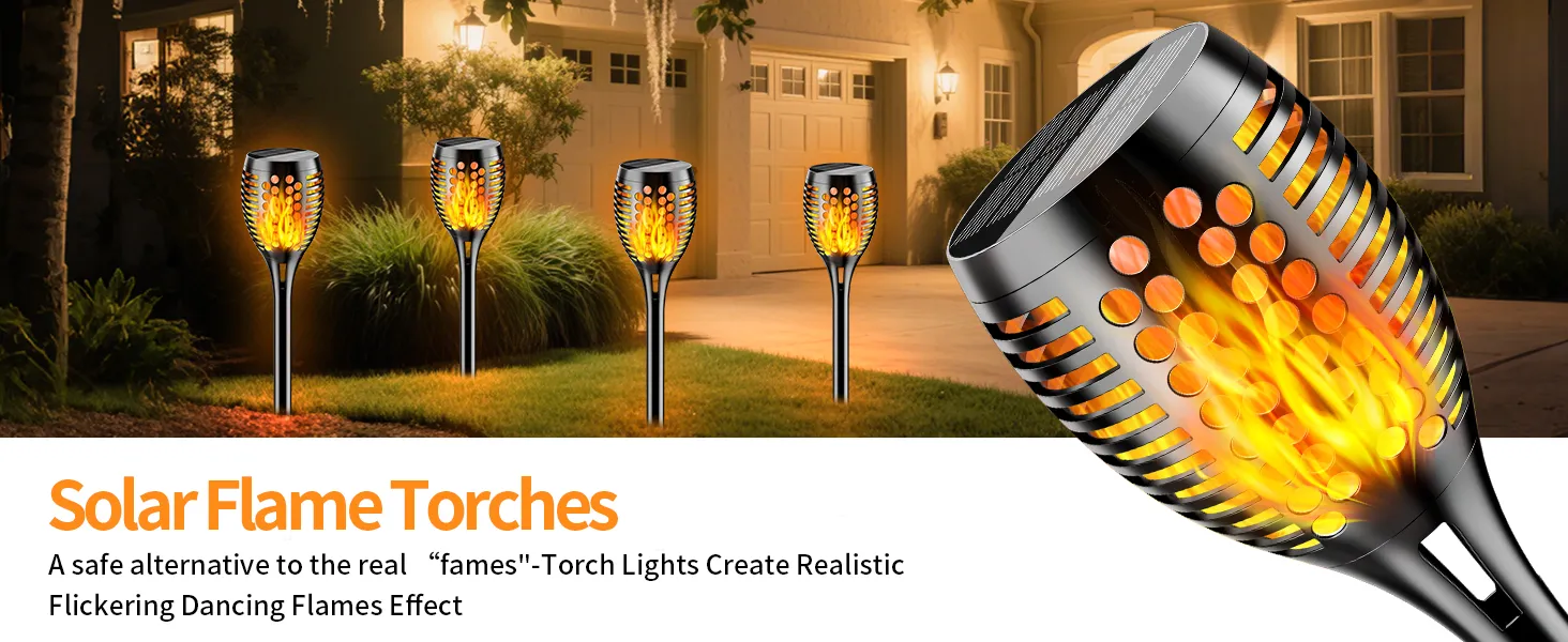 Decorative solar torch lights with flickering flame effect illuminating a garden pathway at dusk.