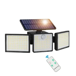 Black solar wall light outdoor lamp glowing warmly on wooden fence