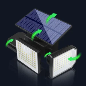 Black solar wall light fixture glowing on garden fence at night