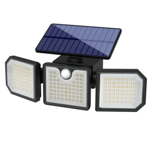 Black solar wall light fixture glowing on garden fence at night